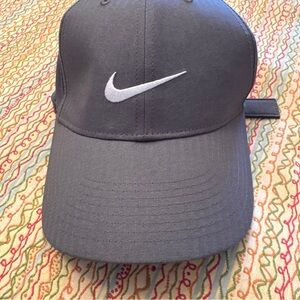 Nike Legacy91 Tech golf hat in gray with a white embroidered swoosh logo.